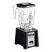 A Blendtec Connoisseur 825 commercial blender with a clear container on top.