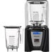 A black and silver Blendtec Connoisseur 825 blender with a glass container.