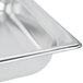 A Vollrath stainless steel steam table pan on a counter.