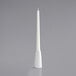 A white pillar candle in a white Acopa taper holder.