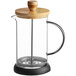 An Acopa glass and wood French coffee press.