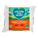 A package of Follow Your Heart medium cheddar vegan cheese.