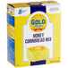 A box of Gold Medal Honey Cornbread Mix on a kitchen counter.