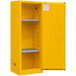 A yellow metal Durham Mfg flammable storage cabinet with shelves.