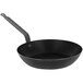 A black frying pan with a handle.