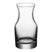 An Acopa clear glass carafe with a short neck.