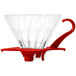 A Hario V60 red glass coffee dripper with a red handle.