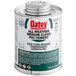 A white can of Oatey clear PVC all weather cement with a green label.
