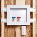 A white Oatey Quadtro washing machine outlet box with two valves in it.