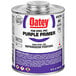 A 32 oz. can of Oatey purple primer for PVC and CPVC pipe with a purple label.