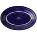 A cobalt blue oval platter with a white border.