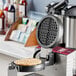 An Estella waffle plate for a MX1A or MX2A waffle maker on a counter.