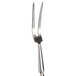 A Winco silver forged pot fork with a long handle.