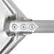The metal handle of an American Metalcraft Deluxe Aluminum Pizza Peel with two holes.