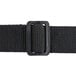 A close-up of a black fabric belt with a metal buckle.