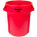 A red Rubbermaid Brute trash can with black lid.