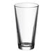An Acopa Select mixing glass with a clear bottom.