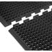 Two black Cactus Mat Duralok interlocking rubber mats with beveled edges and holes.