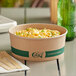 A round EcoChoice compostable take-out container filled with macaroni and cheese.