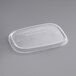 A clear rectangular EcoChoice PLA take-out container lid with text on it.