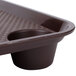 A brown GET polypropylene tray with cup holders.