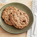 Two Best Maid Thaw and Serve Oatmeal Raisin cookies on a plate.
