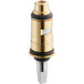 A brass and gold Chicago Faucets ceramic cartridge.