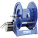A blue Coxreels 1125PCL power cord reel with a metal handle.