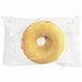 An individually wrapped Southern Roots lemon drop cake donut in a plastic bag.
