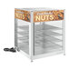 A ServIt countertop display warmer with roasted nuts on a wire shelf.