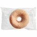 An individually wrapped Southern Roots Original Glazed cake donut in a plastic bag.