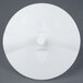 A white plastic round disc with a hole in the center.
