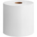 A Tork white notched paper towel roll on a white background.