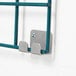 A Metro SmartWall G3 stainless steel grid mounting bracket kit hook on a metal wall track.