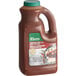 A brown plastic jug of Knorr Jamaican Jerk Sauce with a handle and label.