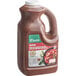 A jug of Knorr Fajita sauce with brown liquid inside.
