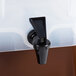 A black plastic container with a Carlisle black faucet.