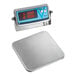 An Edlund wireless digital pizza scale with a stainless steel surface.