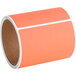 A roll of orange Lavex fluorescent red mailing labels.