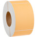 A roll of Lavex fluorescent orange labels with white tape and a brown circle.