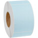 A roll of blue and white Lavex mailing labels.