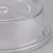 A clear plastic Cambro plate cover with a circular hole.