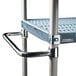 A MetroMax iQ stainless steel mobile shelving unit with an extended handle.