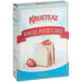 A box of Krusteaz Professional Angel Food Cake Mix with a piece of angel food cake with strawberries on top.
