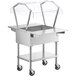 A silver metal ServIt stainless steel ice-cooled food table with a clear cover over food pans.