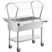 A stainless steel ServIt ice-cooled food table with a clear cover.