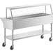A silver stainless steel ServIt cold food table with 5" casters.