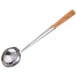 A Town large stainless steel wok ladle with a wood handle.