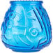 A blue glass vase with a blue Venetian candle in it.