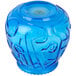 A blue glass vase with a pattern on it filled with blue Sterno Venetian candles.